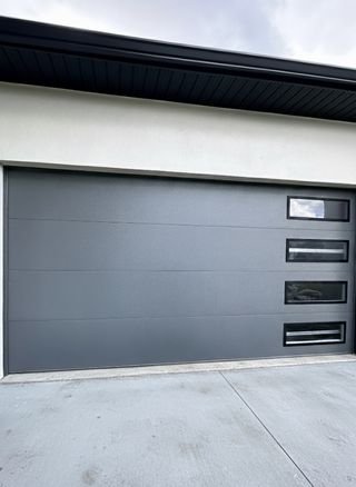 Garage Door Repair Naples FL | Prime Garage Door Modern grey garage door with side windows installed in Naples, FL