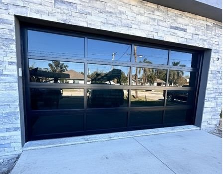 Garage Door Repair Naples FL | Prime Garage Door Modern glass garage door installed on a residential home in Naples, FL